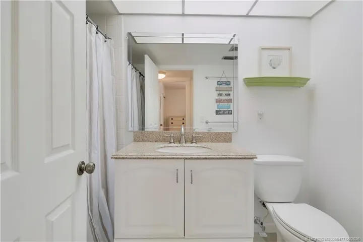 beautifully maintained bath with walk-in shower and updated vanity.