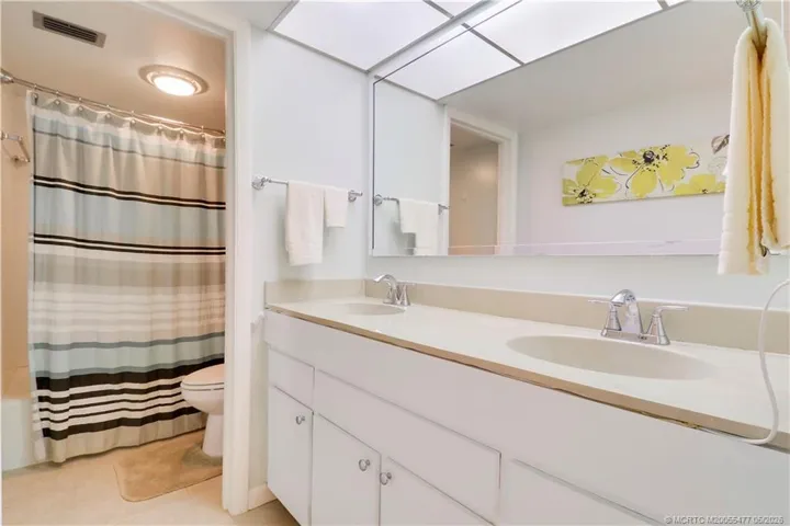 Ensuite bath offers dual vanities and ample counter space.