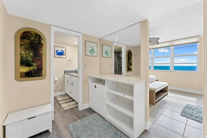 Primary closet area with large vanity mirror!