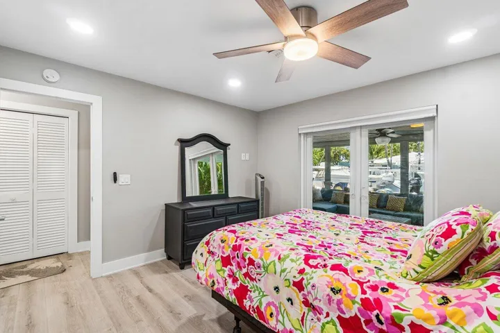 French door access to the enclosed porch and pool patio