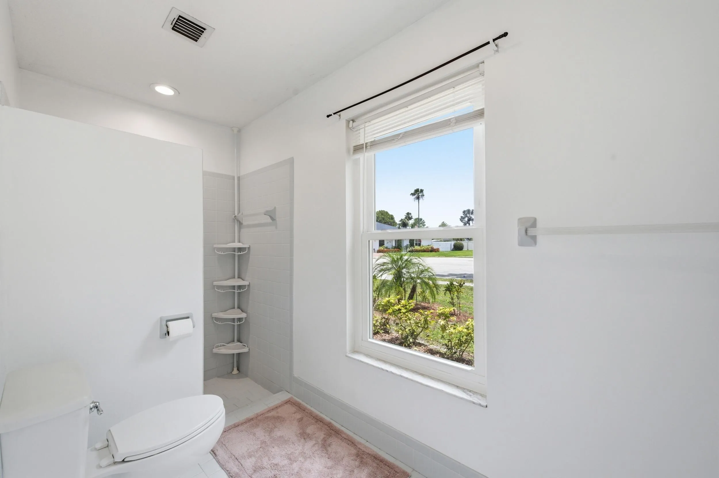 Walk-in shower on one side.