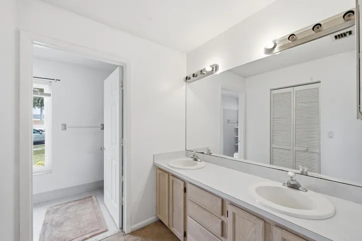 Primary bathroom with dual sink vanity.