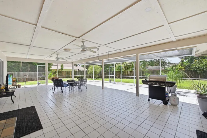 Expansive covered patio with plenty of room for a pool.