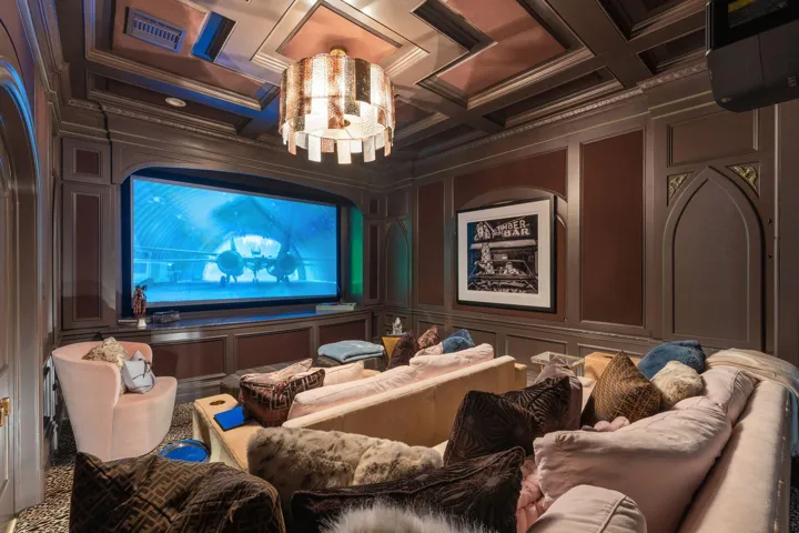 Comfortable separate built in theatre.