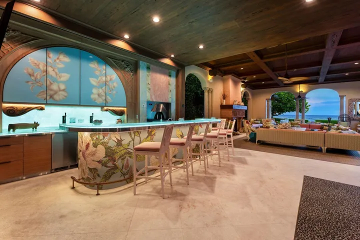 Outdoor bar with custom lighting and built in wood or gas pizza oven