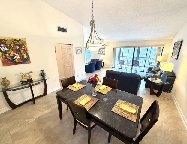 Soaring Cathedral Ceilings Shower light that streams thru the Screened & Open Corner Balconies.