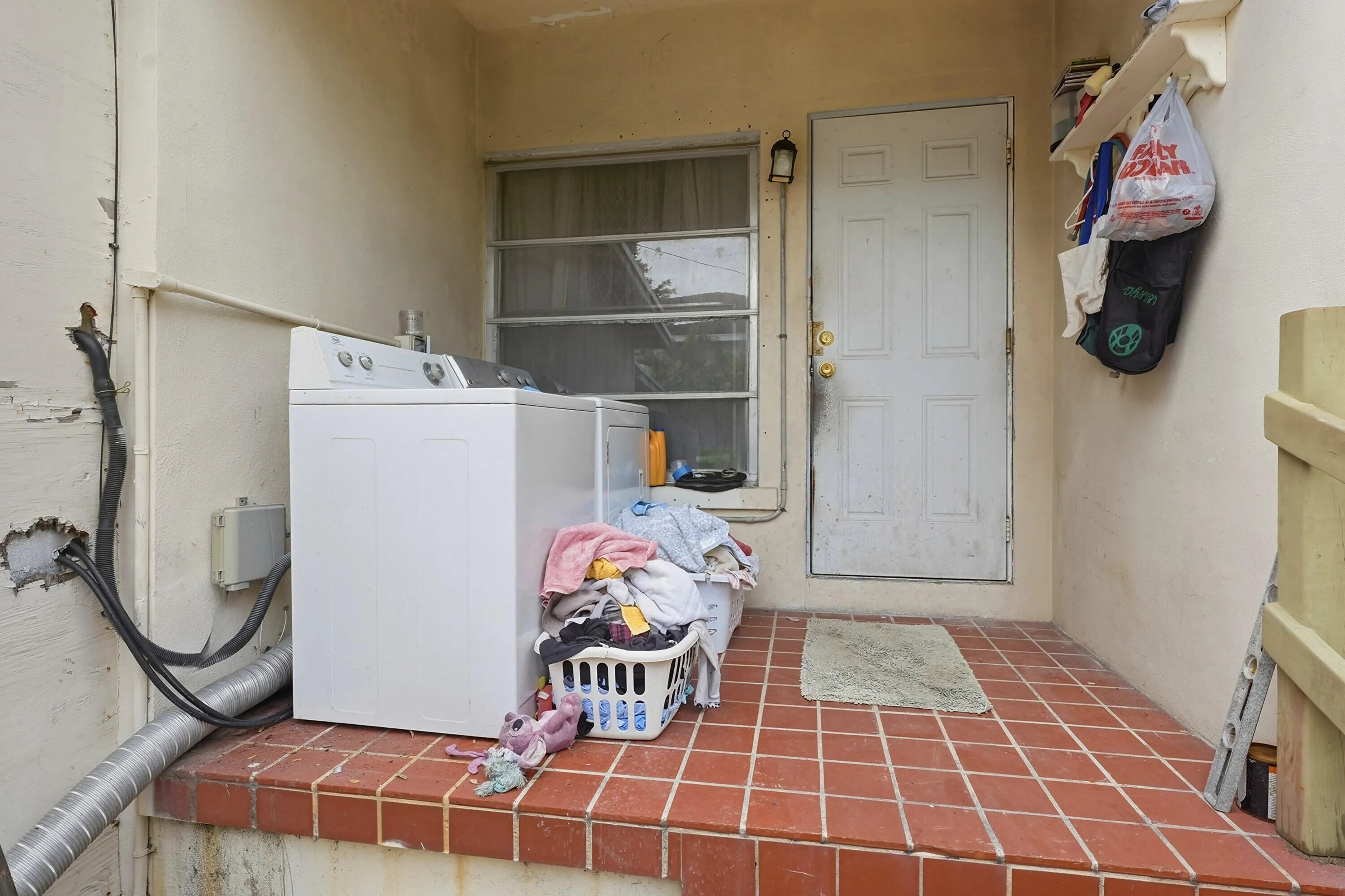 Back porch with washer and dryer