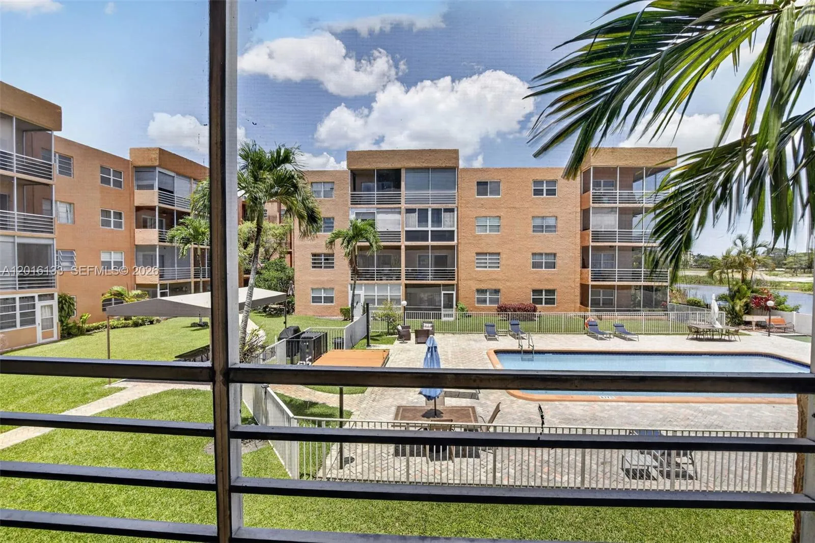 The large screened balcony creates a true indoor-outdoor space, perfect for morning coffee, relaxing evenings, and enjoying the Florida lifestyle.