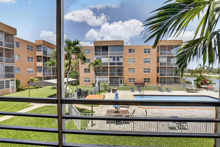 The large screened balcony creates a true indoor-outdoor space, perfect for morning coffee, relaxing evenings, and enjoying the Florida lifestyle.