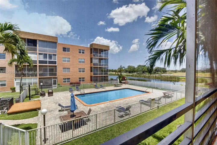 The large screened balcony creates a true indoor-outdoor space, perfect for morning coffee, relaxing evenings, and enjoying the Florida lifestyle.