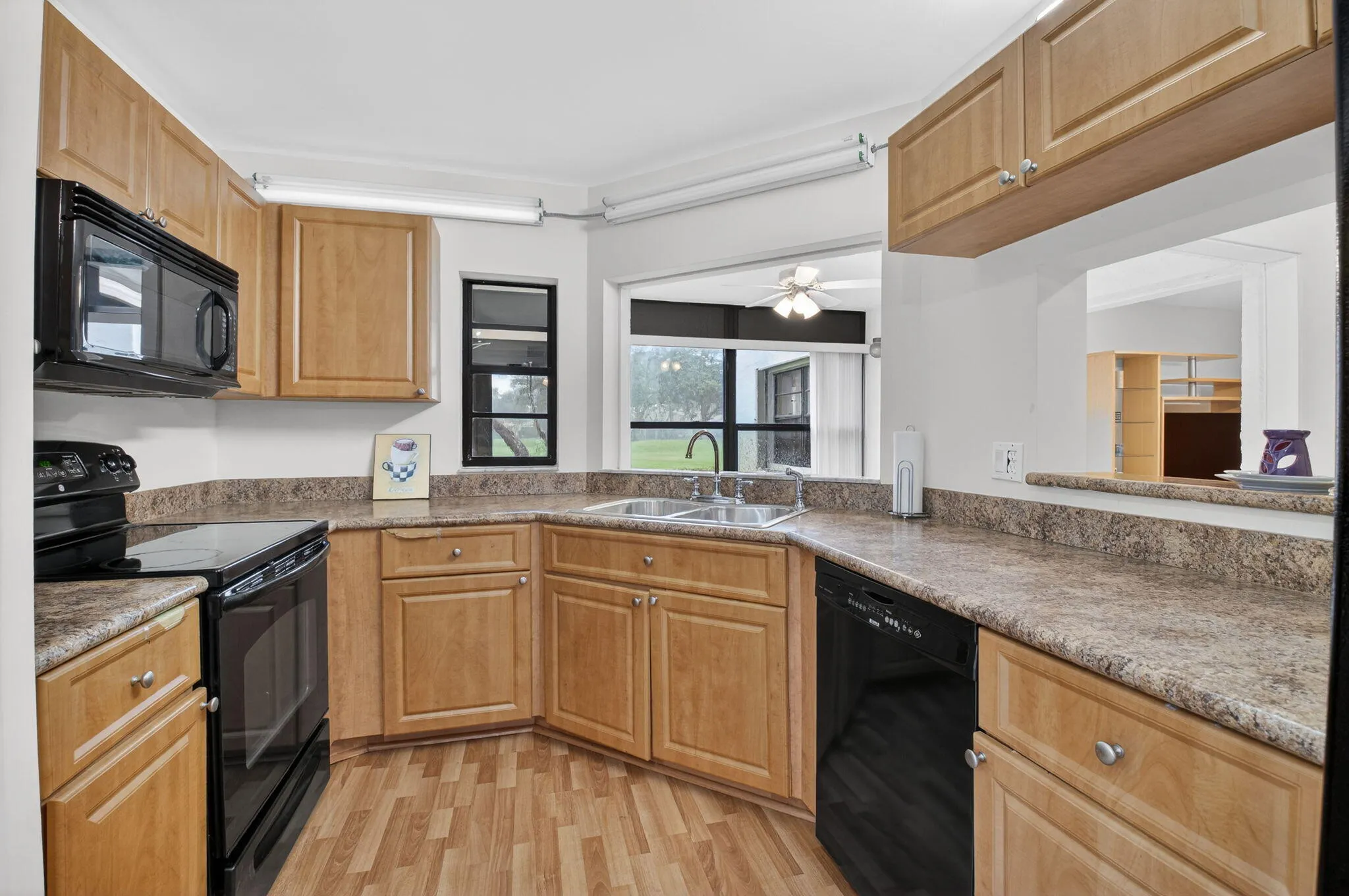 Functional kitchen with abundant cabinetry, counter space and full appliance package.