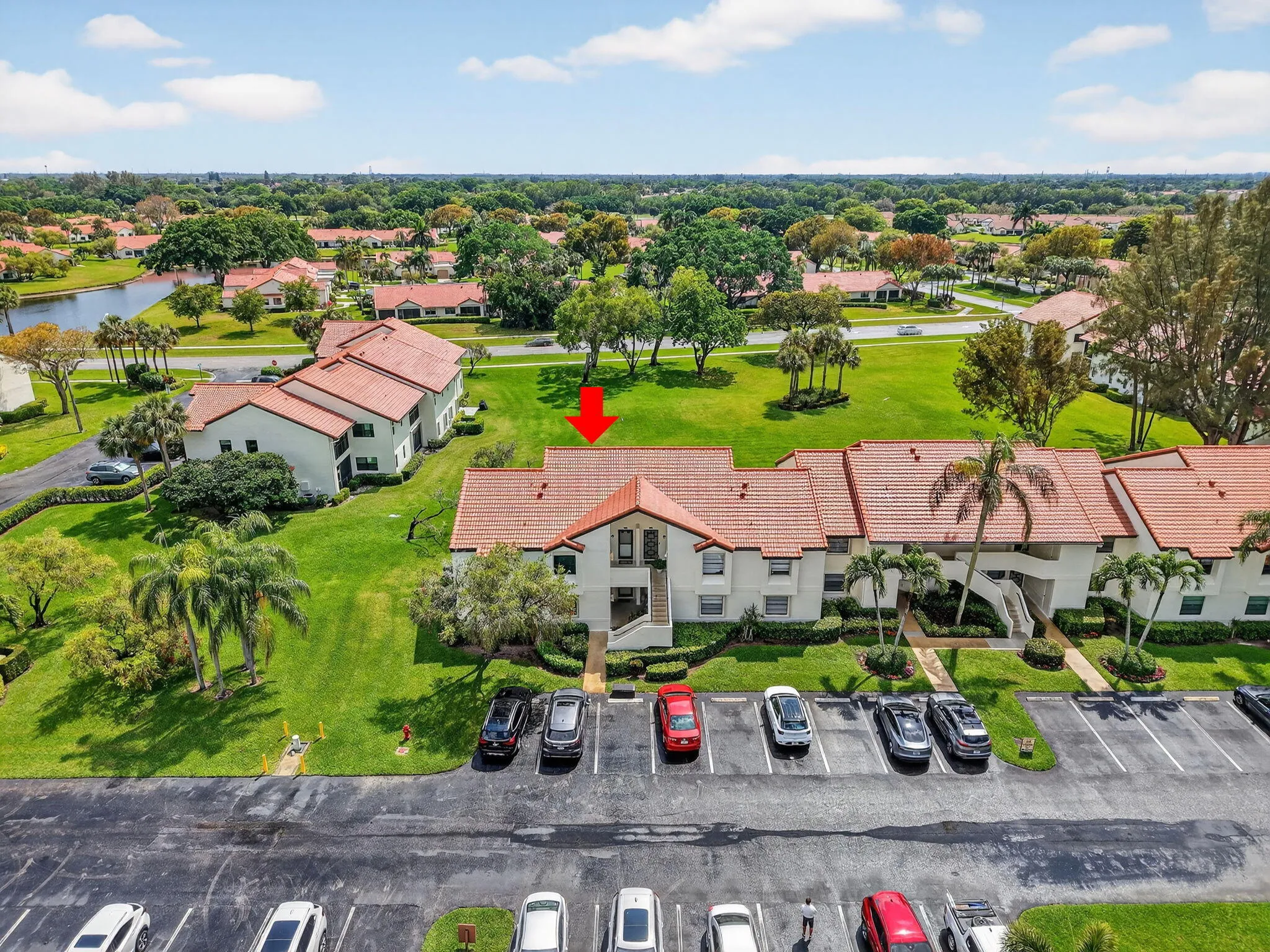 Aerial community view with lots of lush green space surrounding neighborhood.