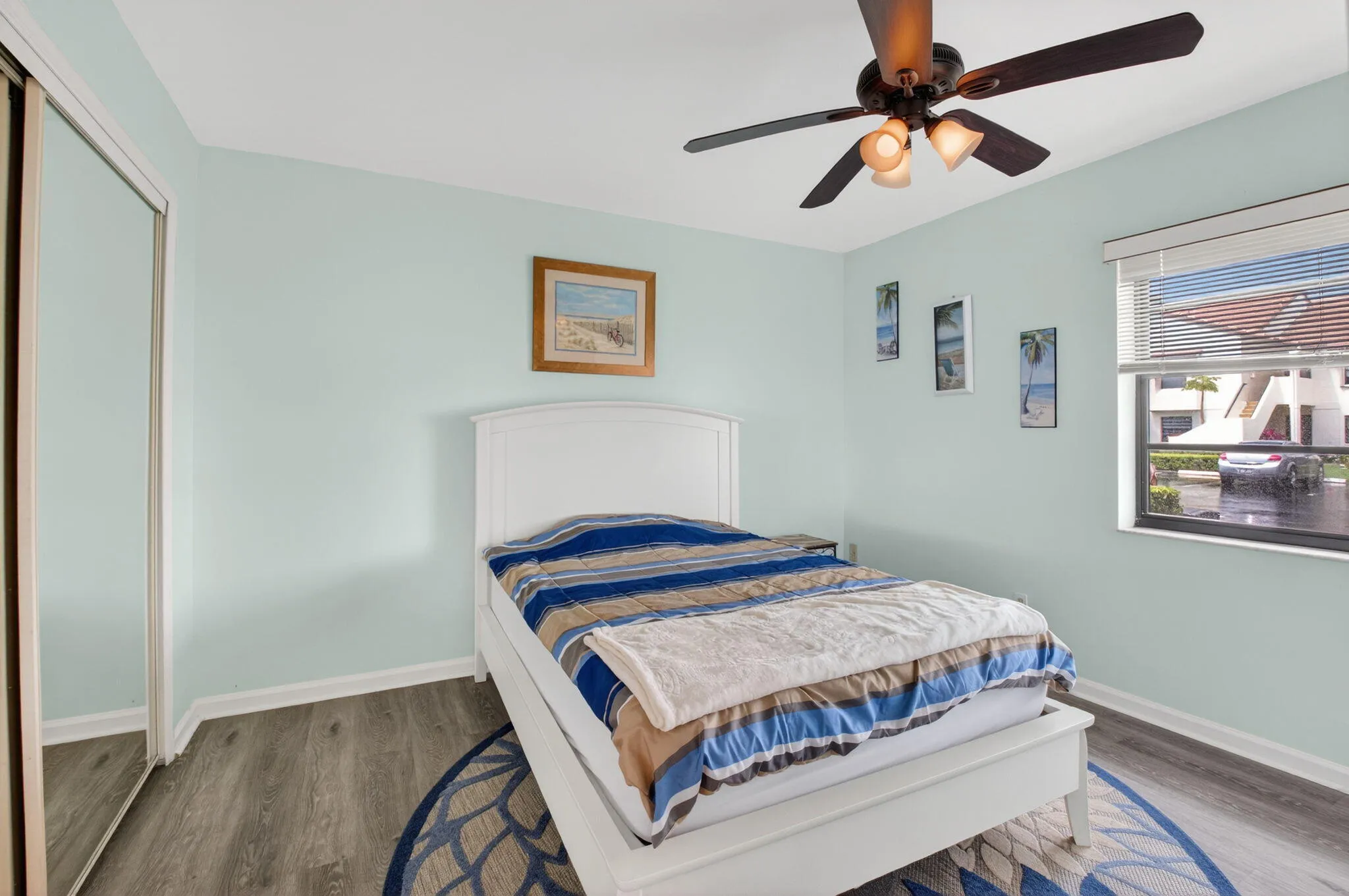 Second bedroom is light and bright with a spacious closet. Flooring is the same as primary bedroom