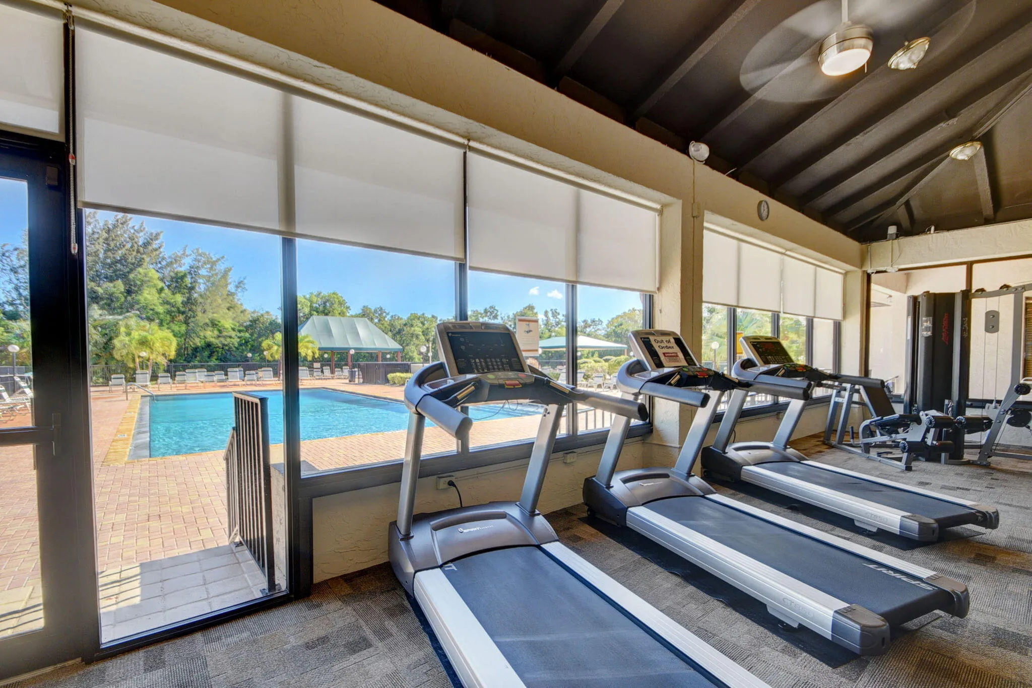 View of fitness center with cardio and strength equipment.