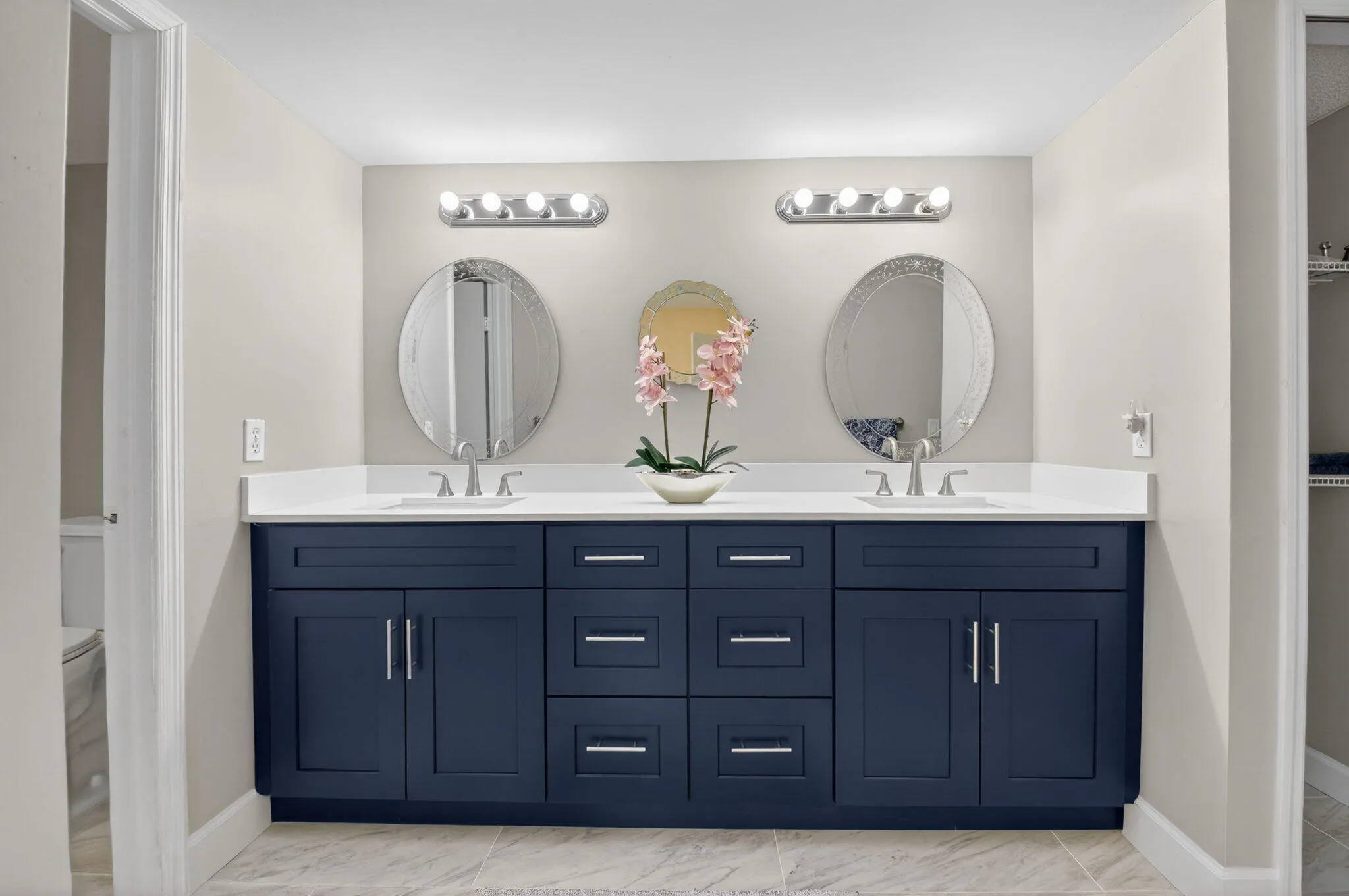 Double vanity bathroom with generous counter space and updated fixtures.