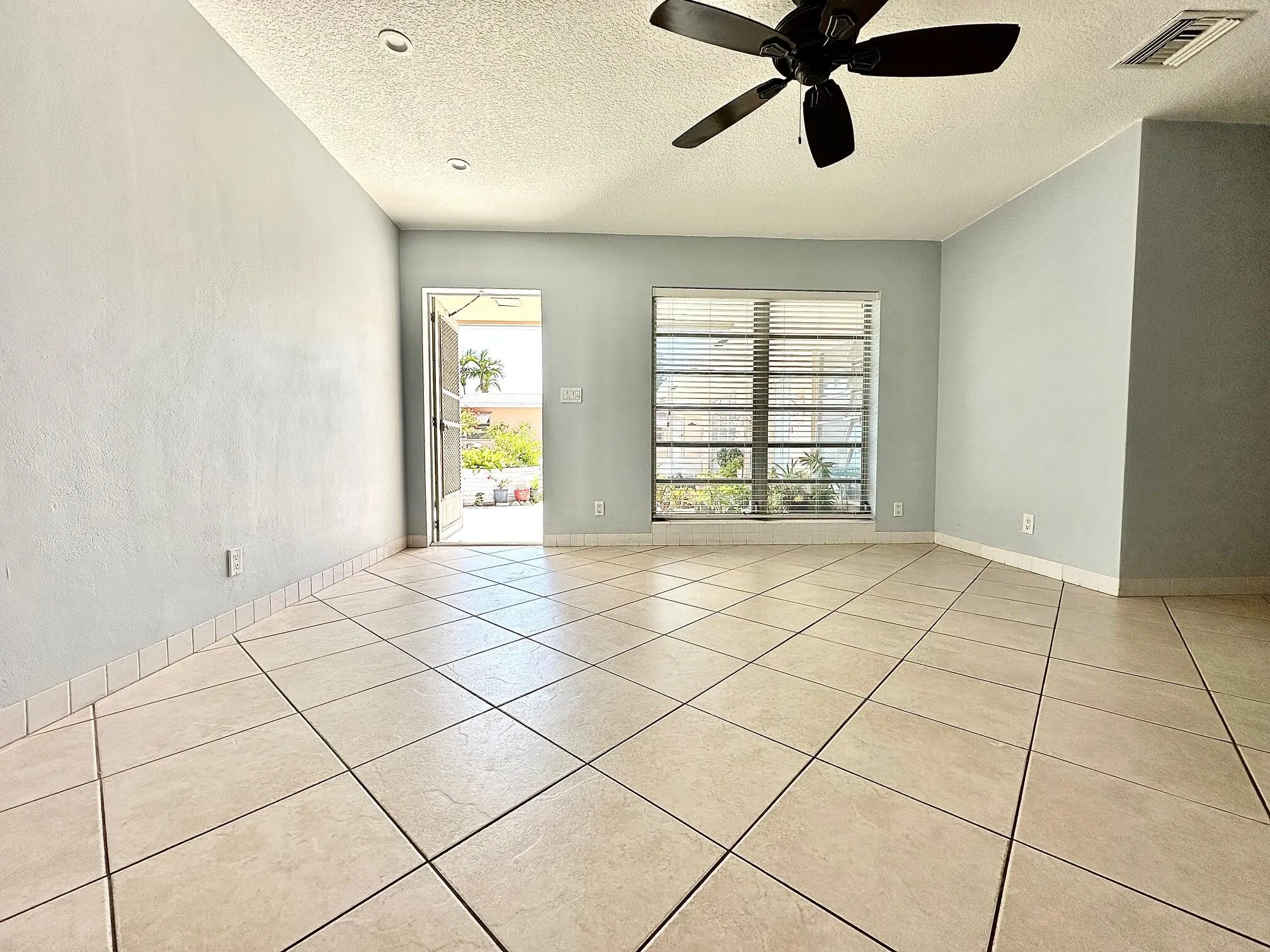 Ceramic tile flooring throughout