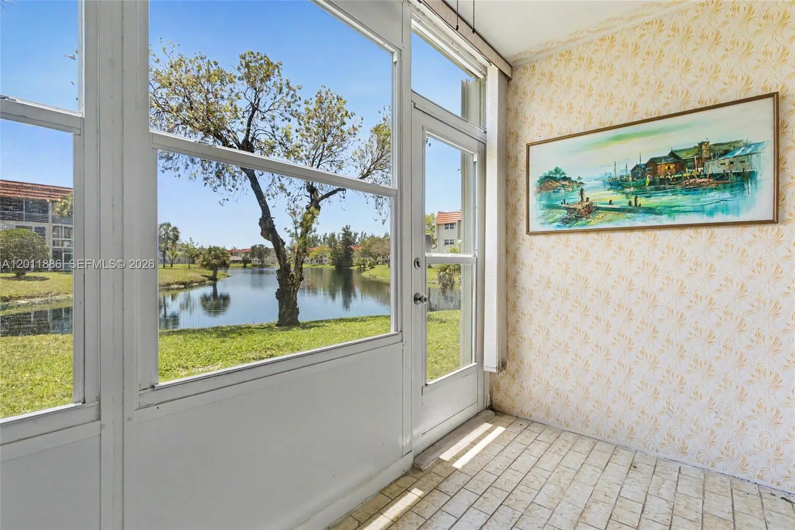 30 steps to the water, sun room has accordion shutters