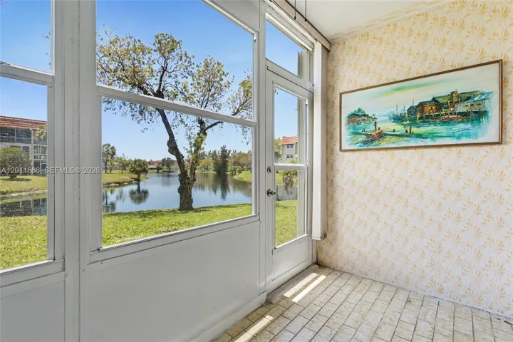 30 steps to the water, sun room has accordion shutters