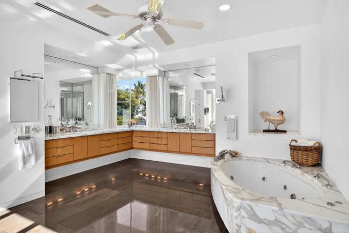 Dual vanities and jetted tub in the primary suite