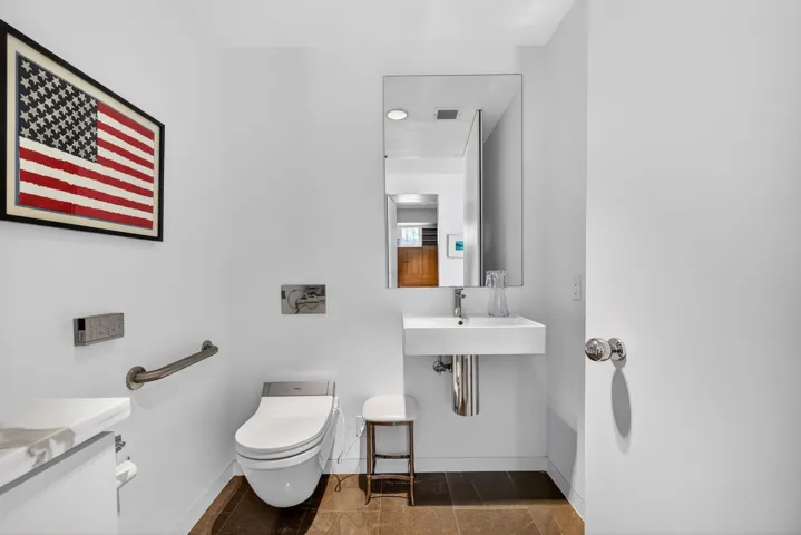 One of two separate water closets in the primary suite