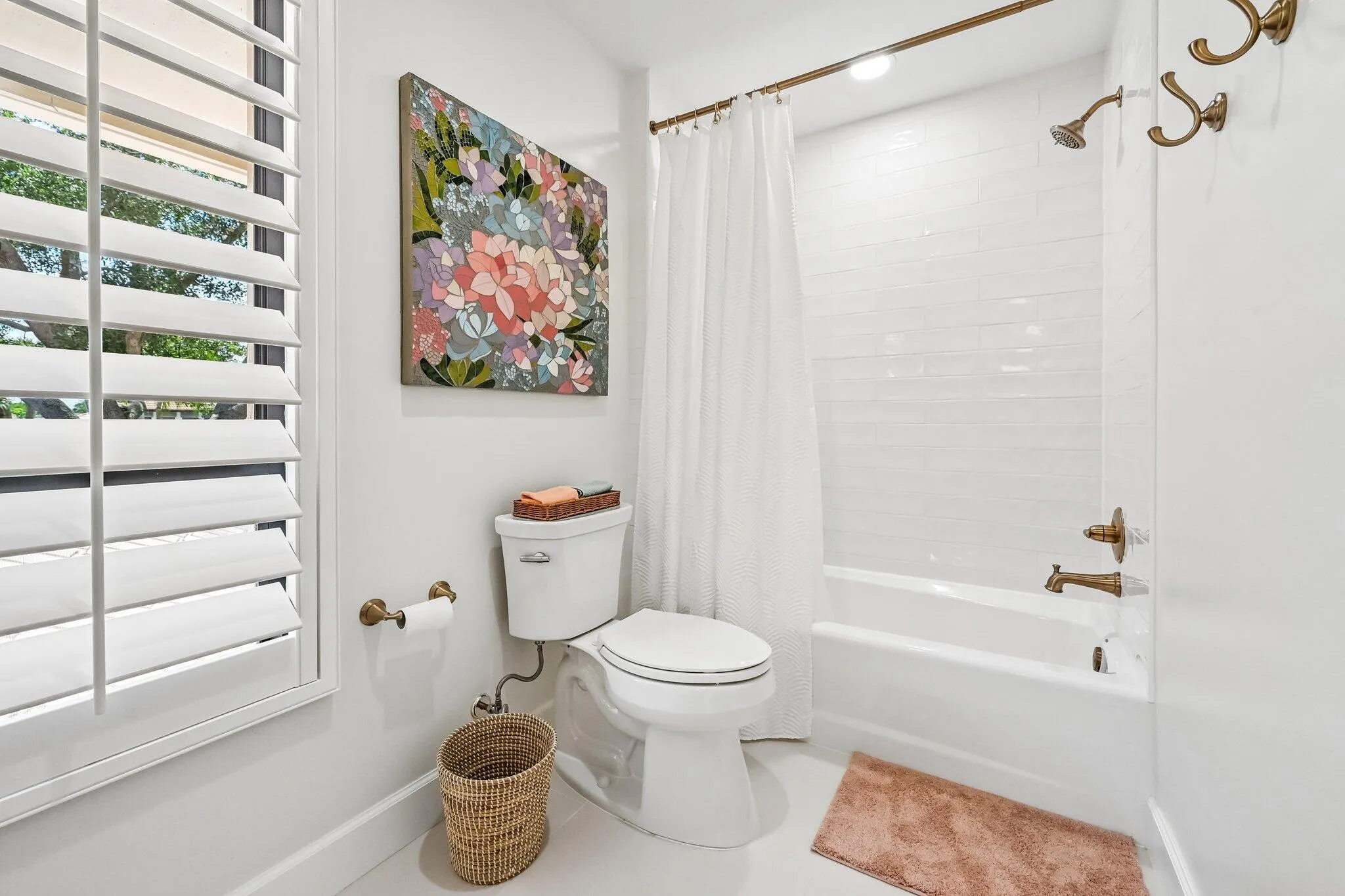 The en suite bathroom for bedroom #4 offers a shower/tub combination designed for everyday ease and functionality.