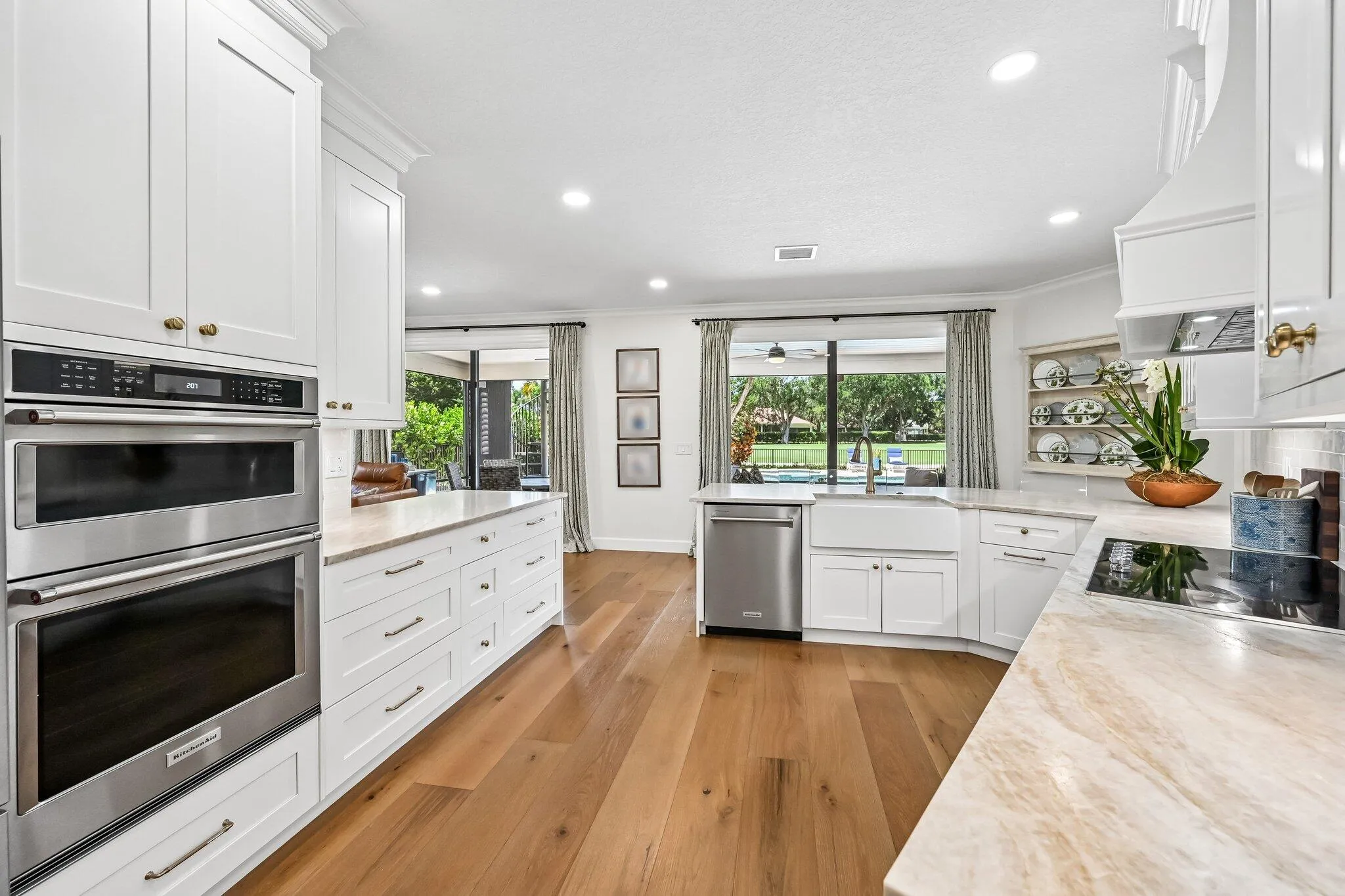 Storage is abundant in this thoughtfully designed kitchen, featuring extensive drawer space and impressive 42-inch upper cabinetry for both style and functionality.
