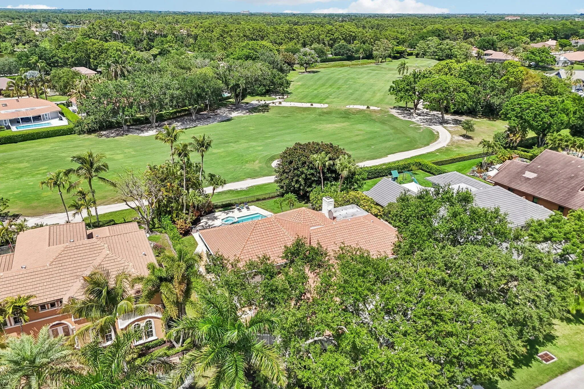 Set on a sprawling 1/3-acre homesite with sweeping views of the 15th hole of The Match Course at PGA National