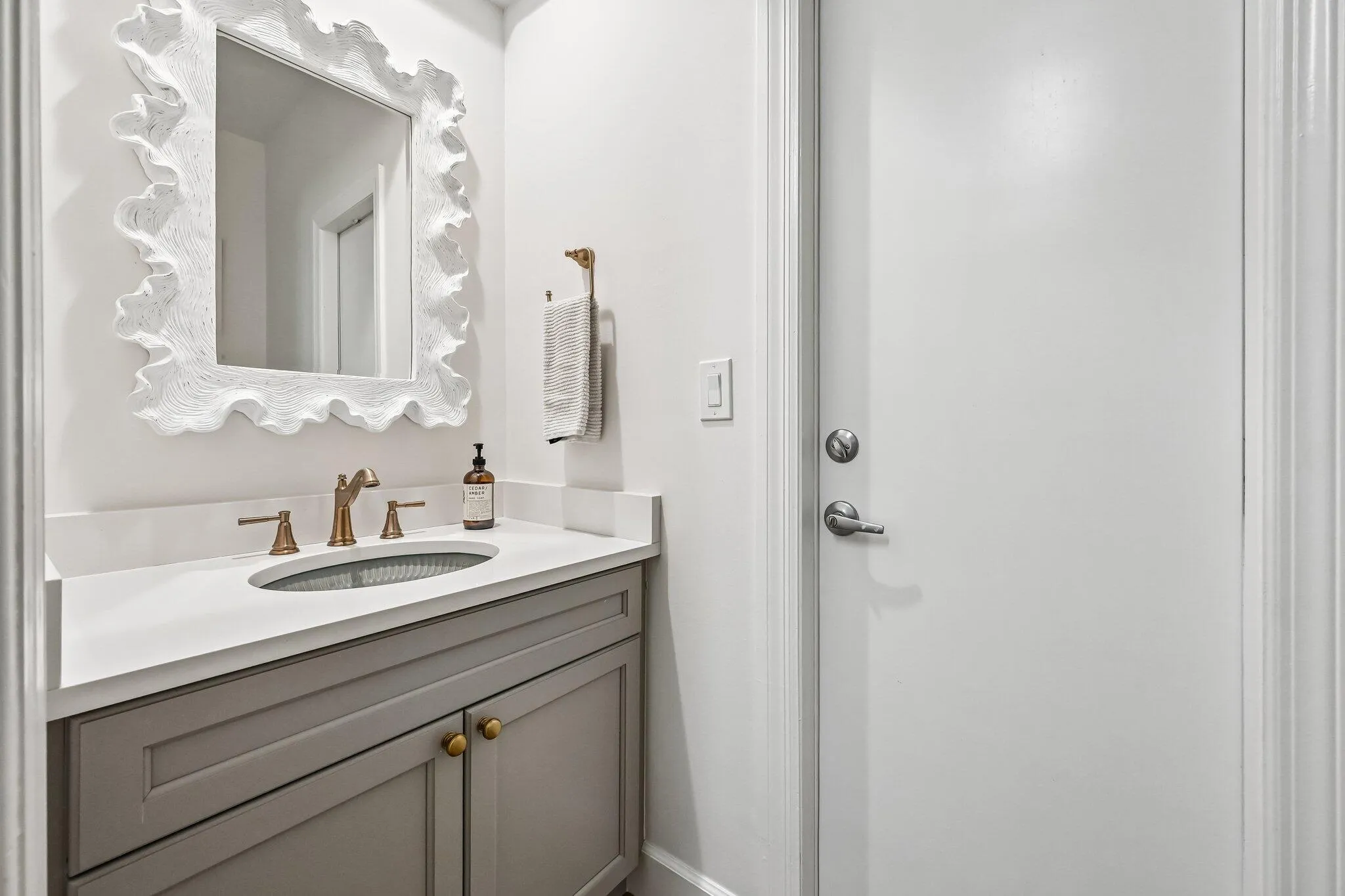Renovated half bath located off of laundry room serves as the pool bath with direct outdoor access
