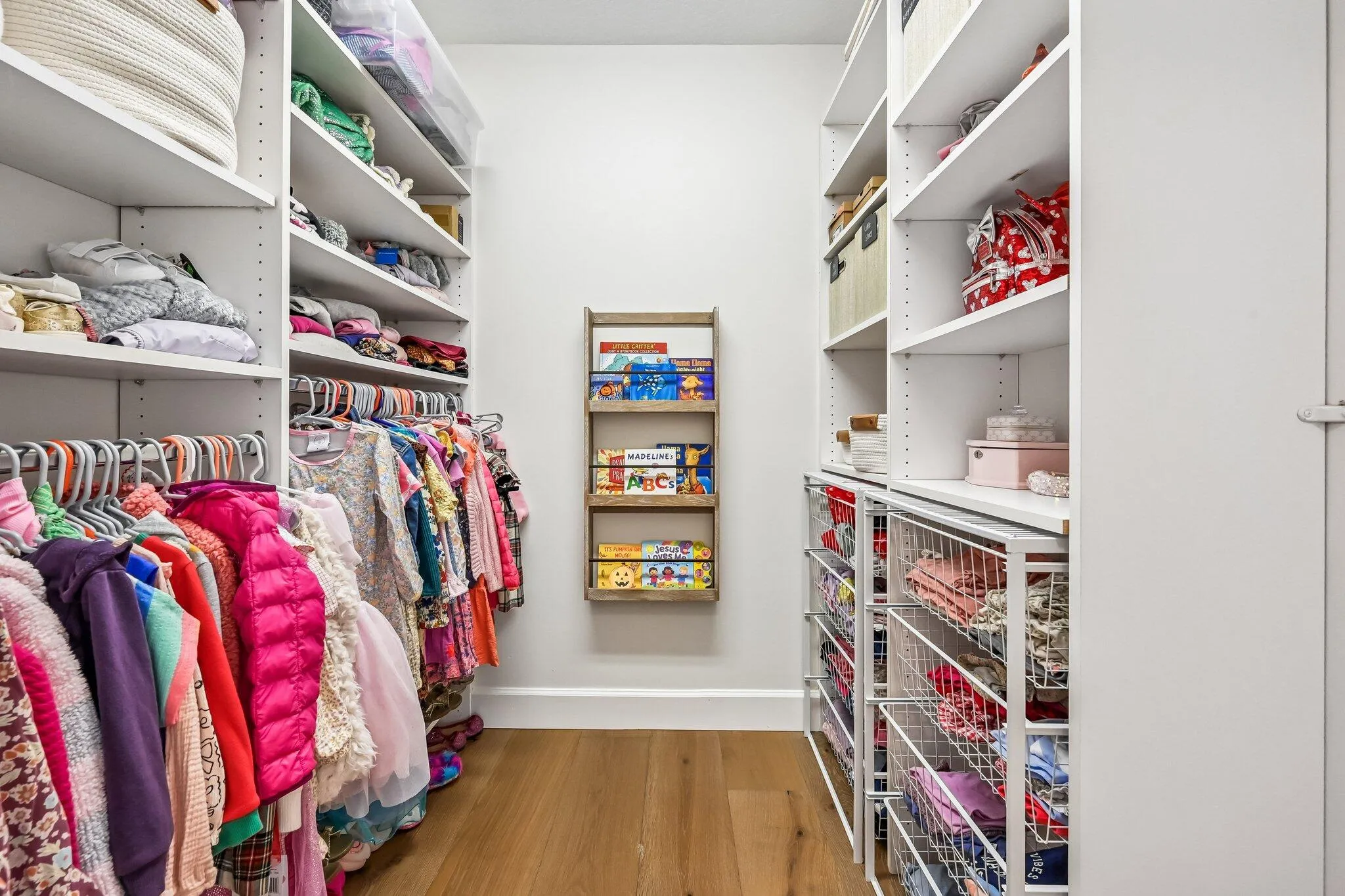 Abundant storage can be found throughout the home with oversized walk-in closets, including this spacious closet in the upstairs fourth bedroom.
