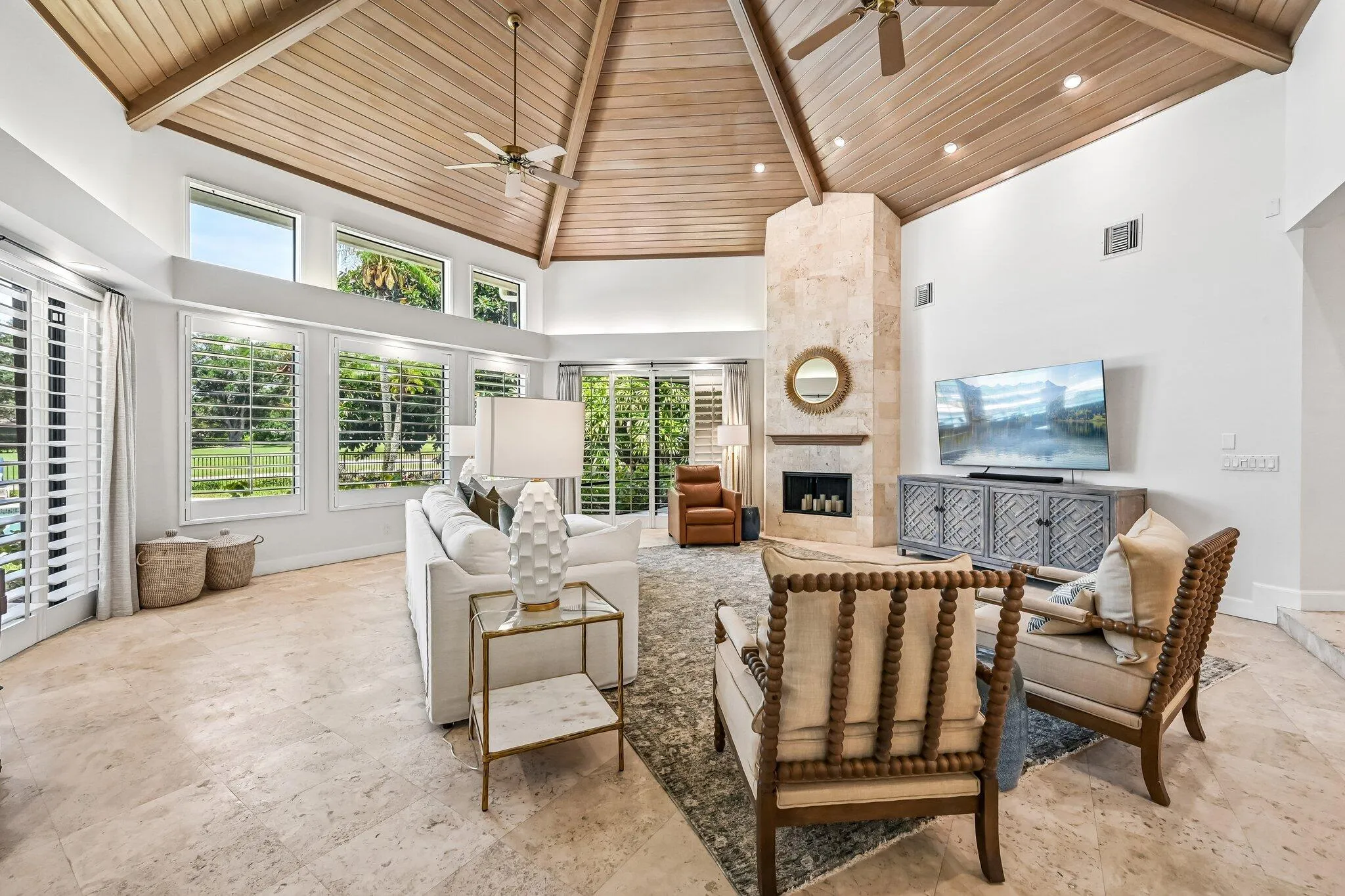 Sweeping views of backyard and golf course from living space