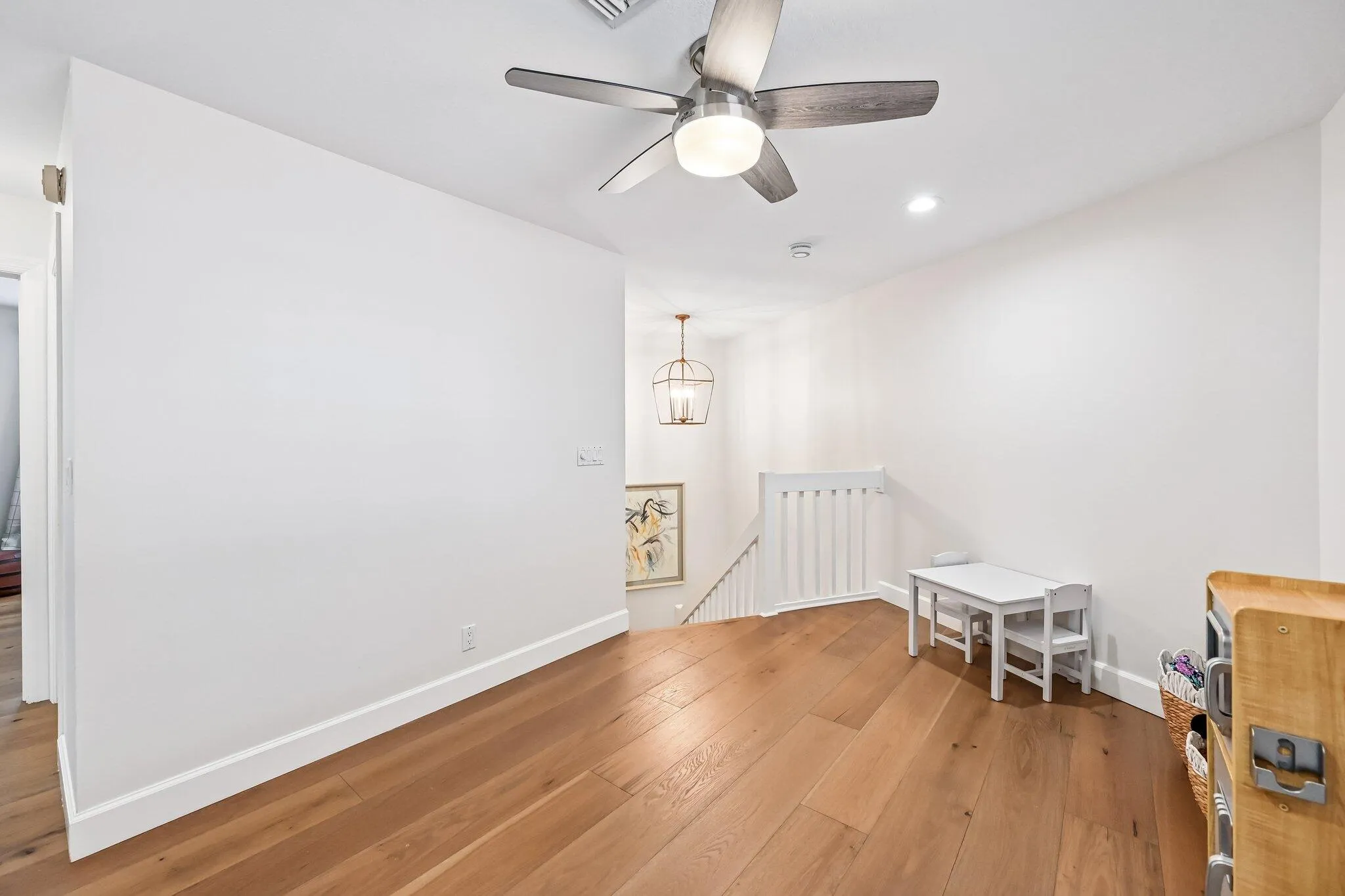 The spacious upstairs loft offers versatile multi-functional space ideal for a media room, office, or additional living area.