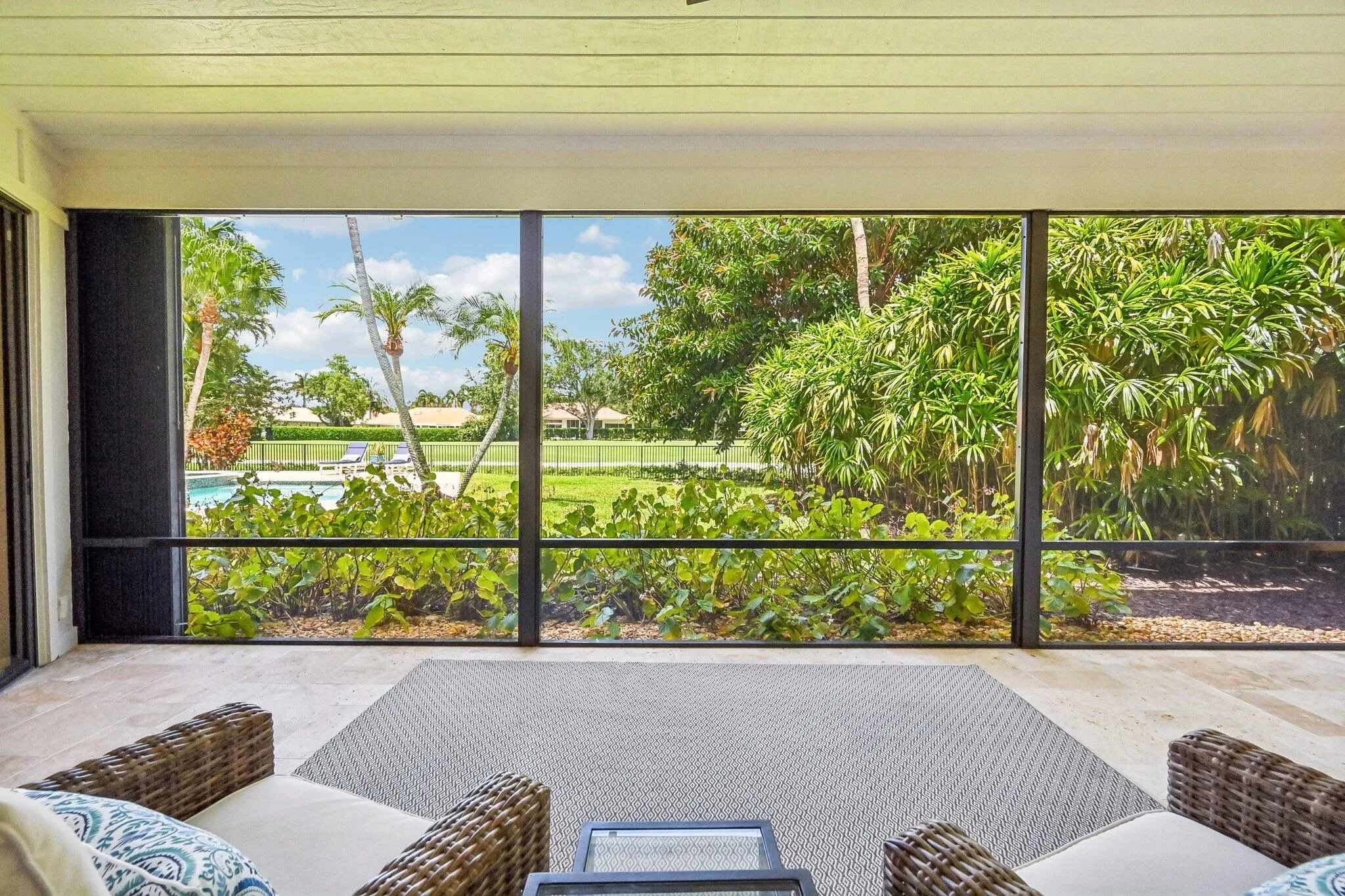 Enjoy a morning coffee in the screened lanai located off of primary suite