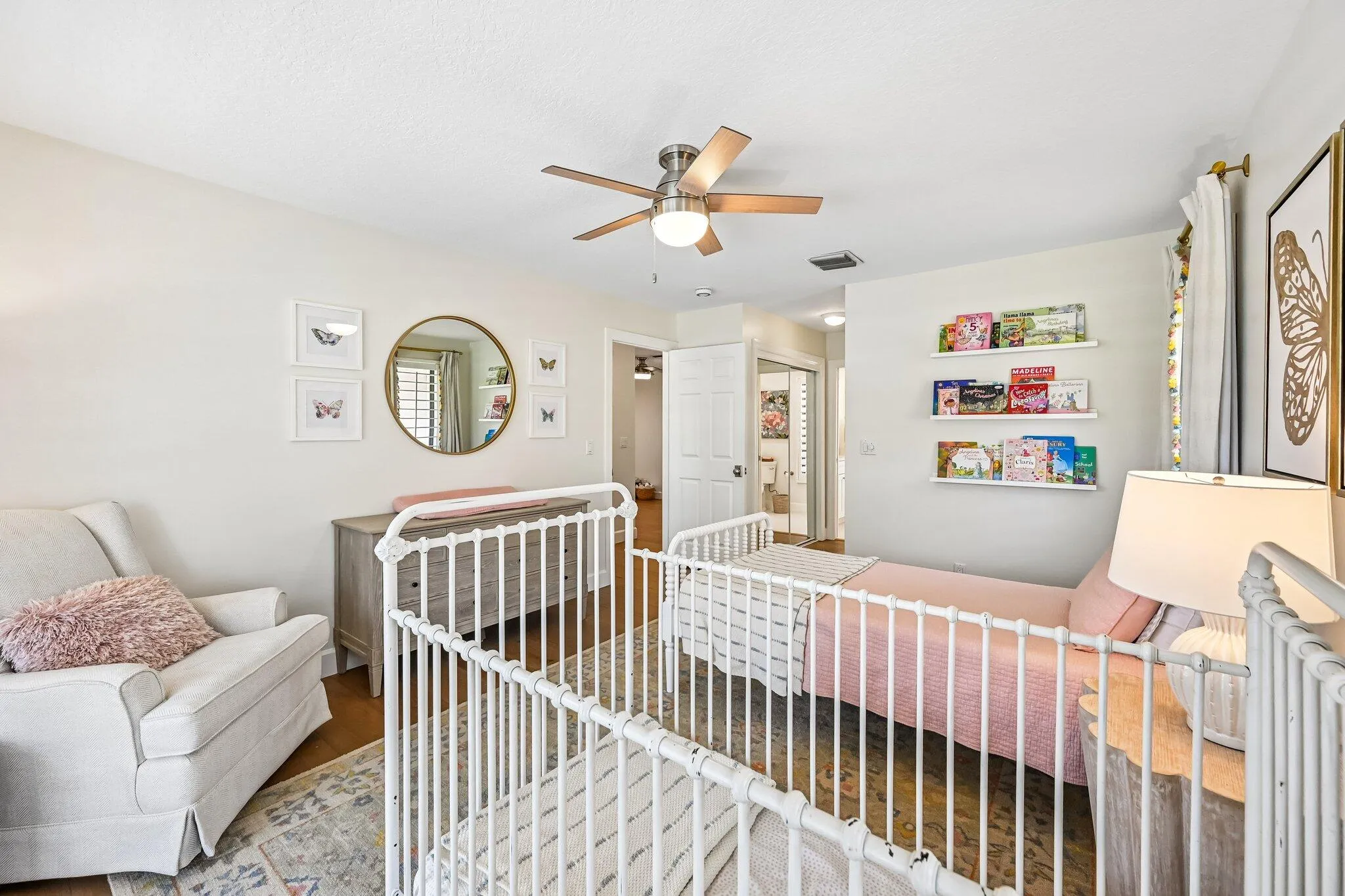 Positioned just off the loft, bedroom #4 offers a bright and airy layout with an en suite bath and sliding doors leading to an open upstairs deck showcasing sweeping golf and pool views.