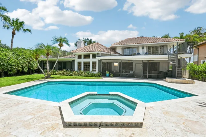 Expansive home with 2 screened lanais and open upper deck and all with golf course views