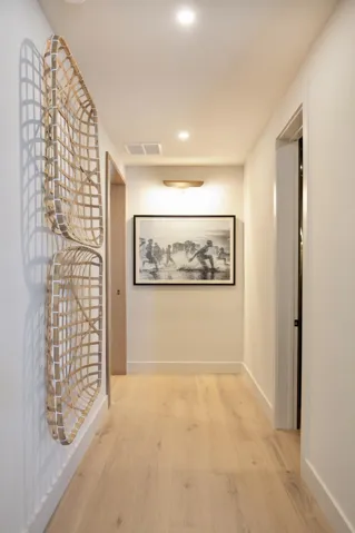 HALL TO POWDER ROOM AND PRIMARY SUITE