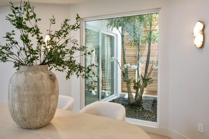 DINING VIEW TO ATRIUM W/2-STORY LOUVERS