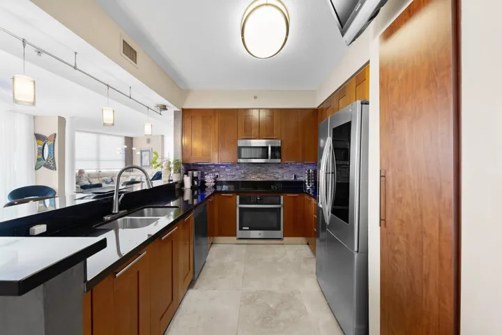 Kitchen with wood cabinetry.