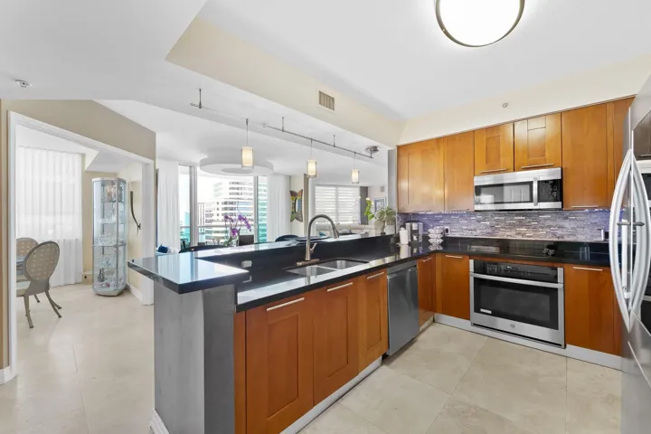 Kitchen with wood cabinetry.