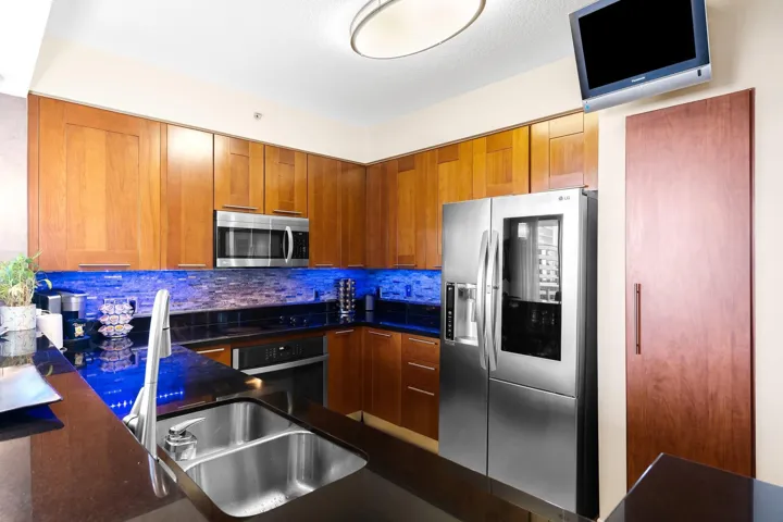 Kitchen with wood cabinetry.