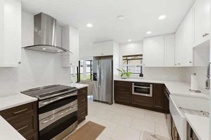 Quartz Countertops, Tile Backsplash with Stainless Steel Appliances