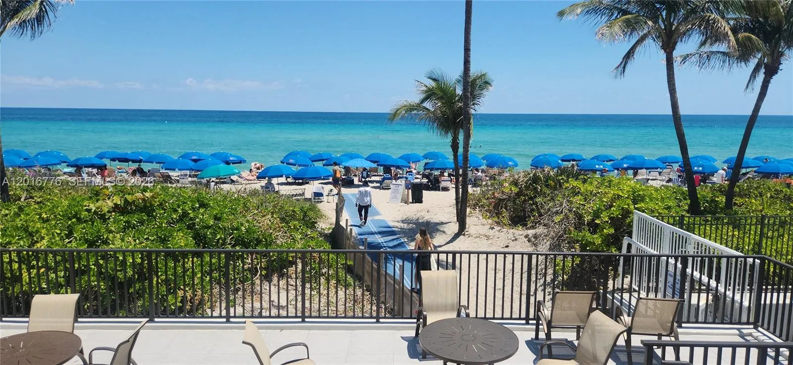 Courtesy Beach //chairs /umbrellas.. service just cross ocean drive and enjoy