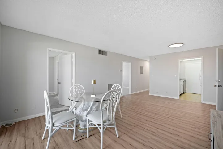 Units PH 1406 & PH 1407 are being sold together for $565,000. Unit 1406 living area, door to kitchen and two bedroom doors.