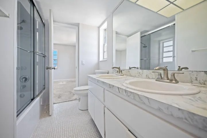 Units PH 1406 & PH 1407 are being sold together for $565,000. Unit 1406 bathroom.