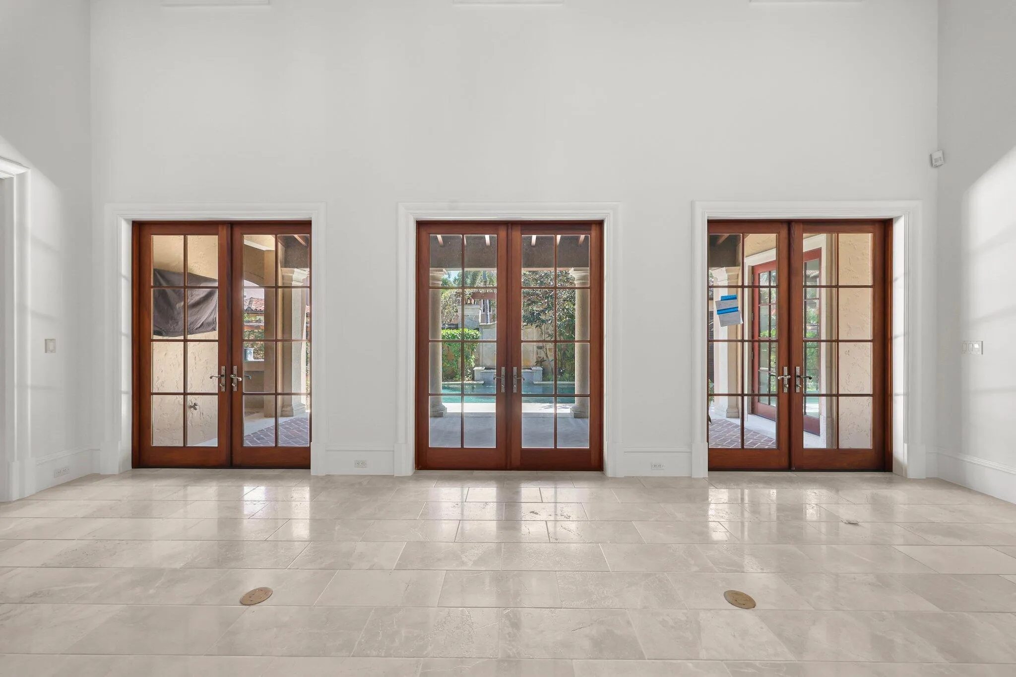Living room access to courtyard and pool