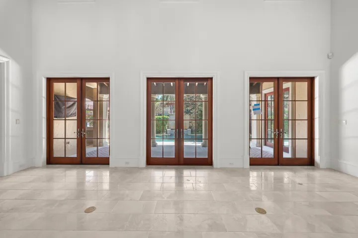 Living room access to courtyard and pool