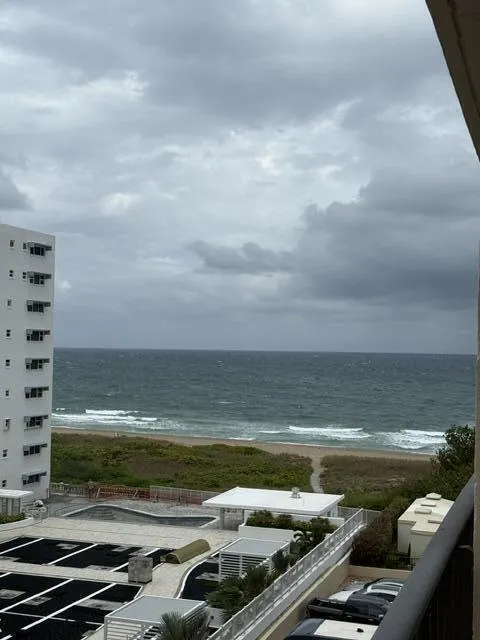 View of beach from balcony on a cloudy morning