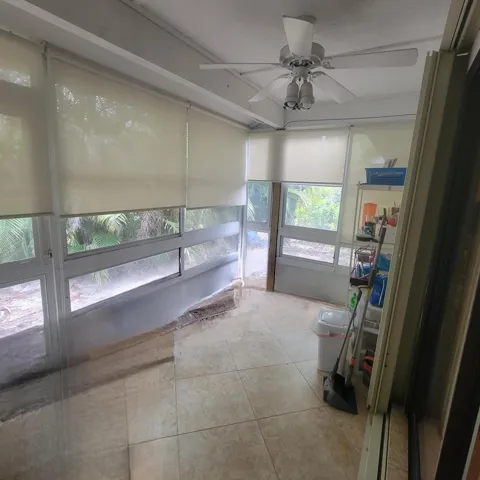 COMPLETE WITH PULL DOWN INTERIOR ACCORDION SHUTTERS