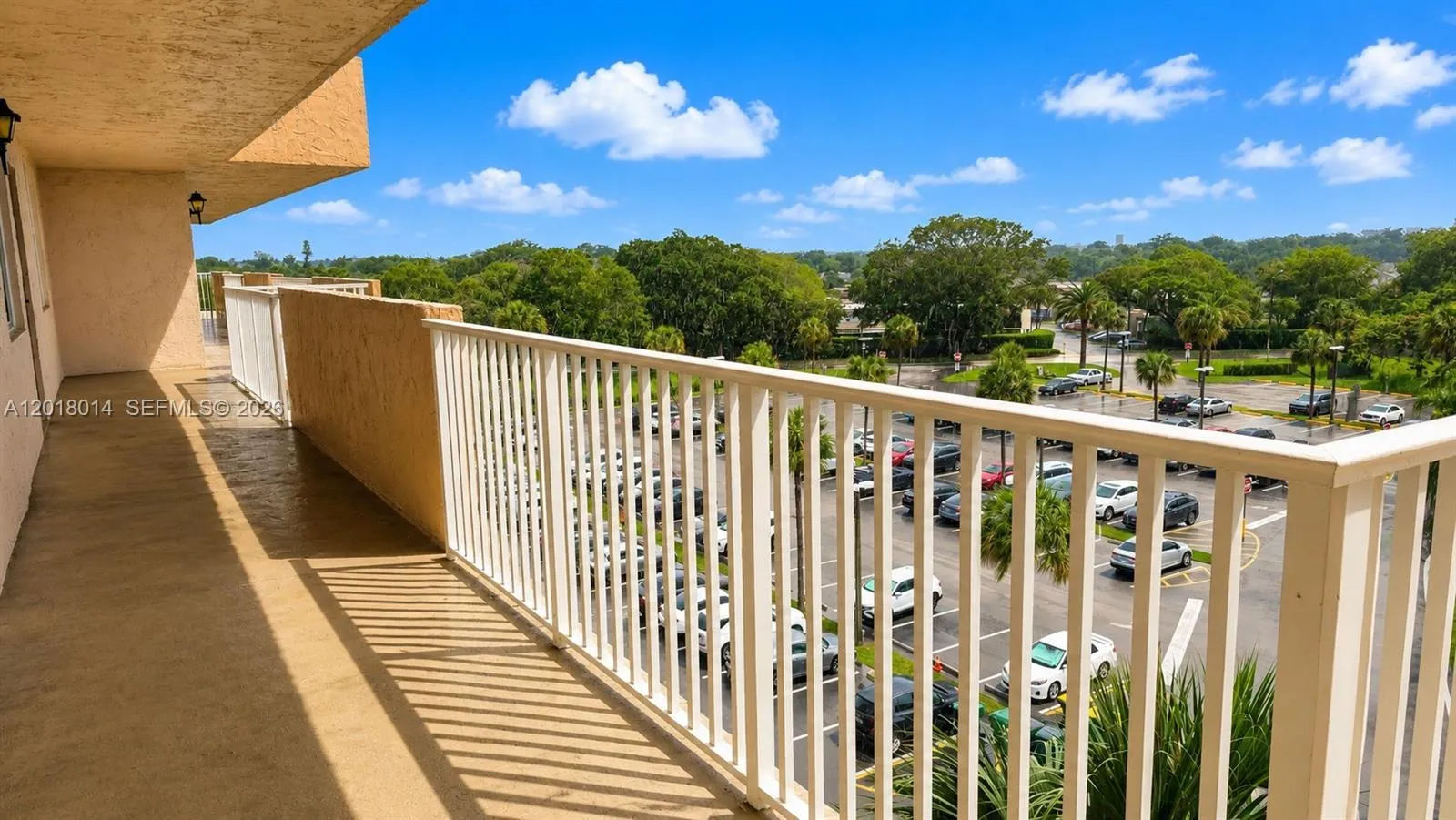 outside hallway to the Unit, view to the left side parking lot