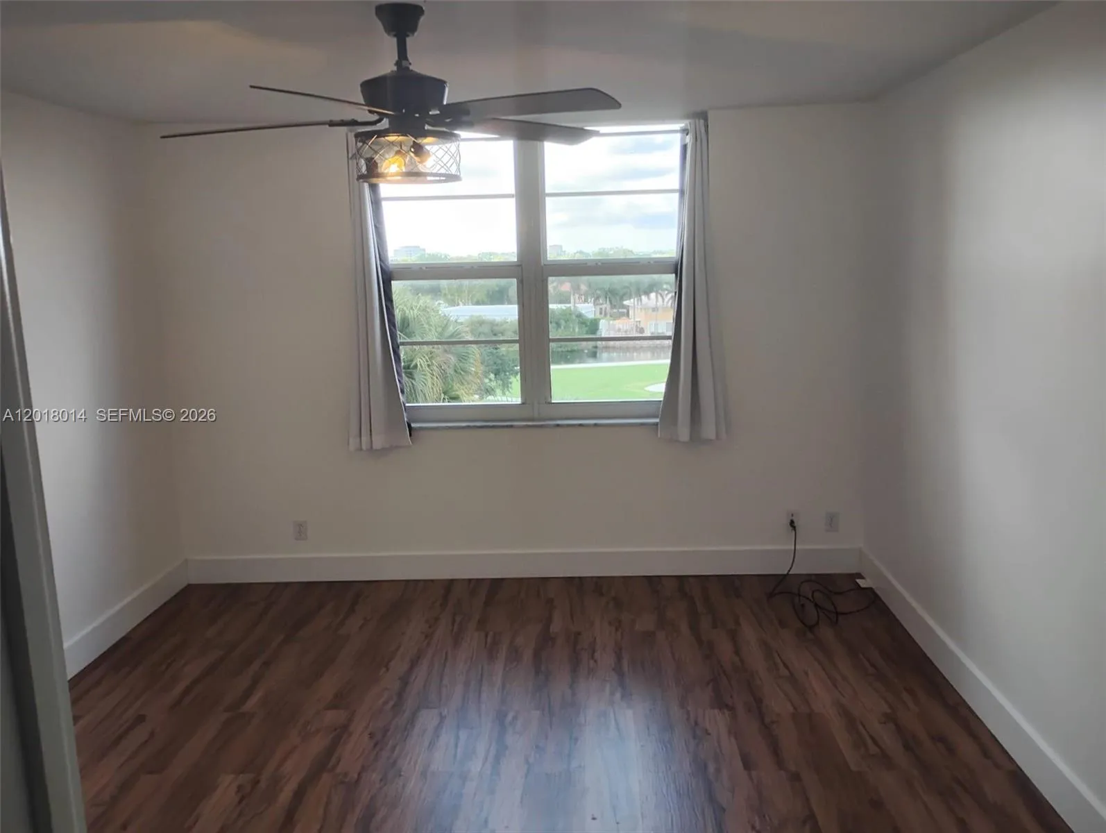 Master Bedroom with a calming view to the Garden and Golf Course