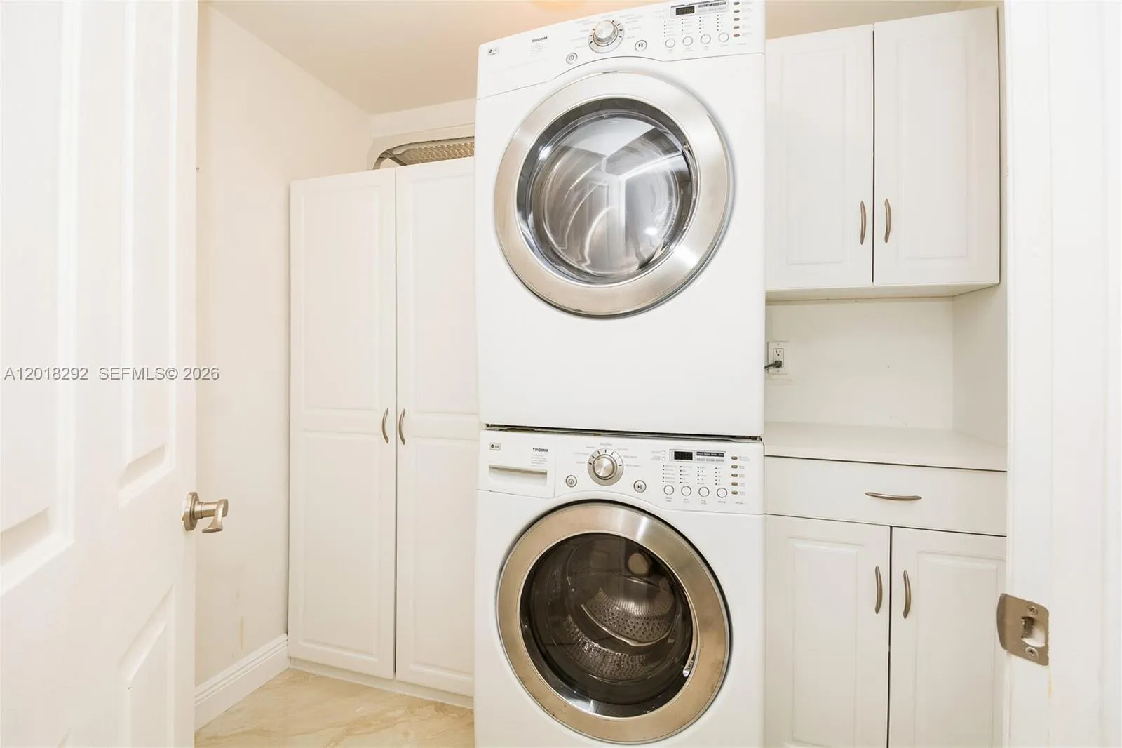 In unit laundry room with storeage